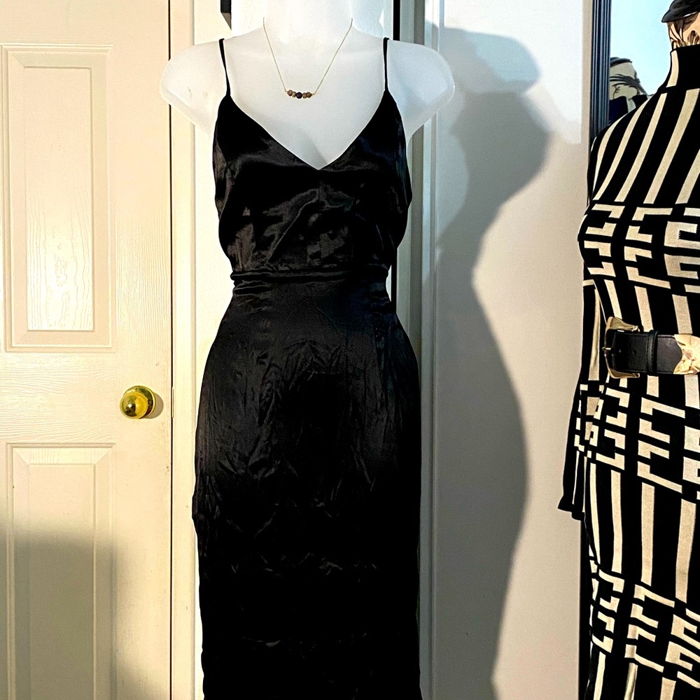 Little black dress with a slip on right side of leg.